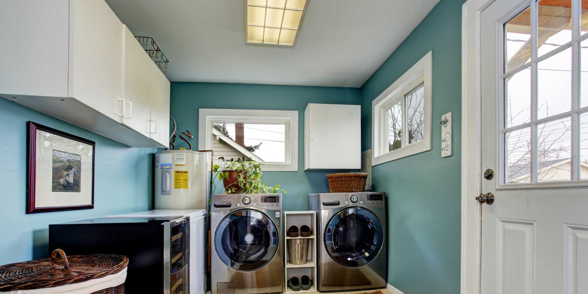 laundry room with painted walls of a blue color